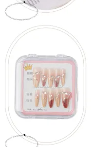 Handcrafted press-on nails with luxury rhinestones, elegant gradient design, medium-long length.