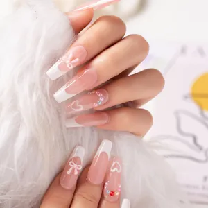 Nude pink gradient French press on nails with cute 3D bows and pearls for sweet girls.