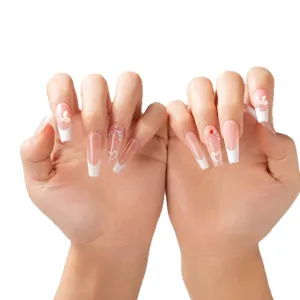 Ins style nude pink gradient french press-on nails with pearls and cute white bow design.