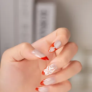 Handmade press-on nails with red french tips, 3D flower and rhinestones for sweet style.