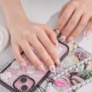 Handmade press-on nails with 3D floral art and nude gradient design for elegant style.