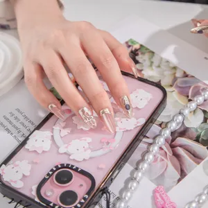 Handcrafted long press on nails with cat eye gel metallic edge and 3D rhinestone decorations for daily wear.