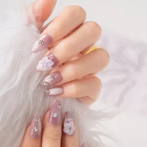 Short press on nails with sweet 3D floral design and shiny rhinestones for sweet style.