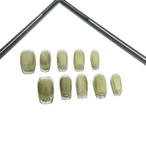 Avocado green press-on nails set with cat eye effect and glitter borders for daily wear.