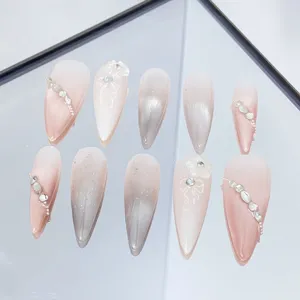 Handmade press-on nails with gradient pink silver rhinestones, sweet and cool long stiletto nail art.