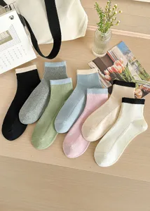 Close-up details of striped cotton crew socks with contrast color ribs in multiple colors.