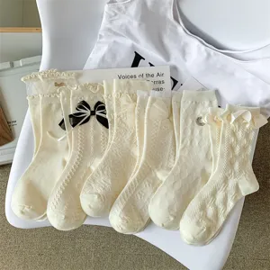 Japanese style sweet white ruffle lace bow mid-calf socks for cute Lolita outfits.