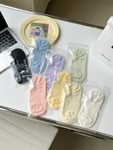 Detail shot of cute dot-dispensing invisible boat socks for women in various lovely colors.