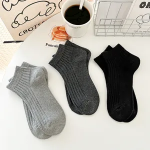 Minimalist solid color low cut ankle socks for men and women, comfortable daily casual wear.