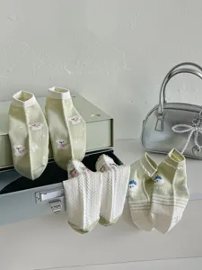 Cute green floral short socks pastoral style detail view featuring lovely puppy patterns and bow details