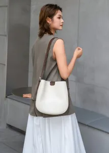 Classic genuine leather bucket bag detail showing premium minimalist style for daily office commute.
