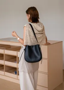 Genuine leather black bucket bag for women, minimalist shoulder crossbody handbag.