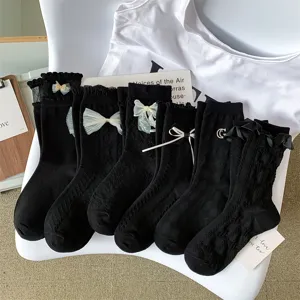 Detailed view of Japanese style black lace bow socks, cute lolita mid-tube cotton socks.