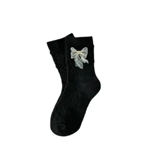 Japanese JK cute Lolita mid-tube socks for women with sheer bow and lace design.