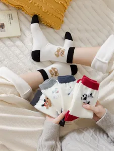 Thickened warm wool socks for women, cute cartoon bear color block design, cozy winter mid tube socks.