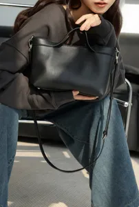 Premium genuine leather shoulder bag for women, chic black crossbody handbag with top handle.