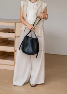 Detailed view of the elegant black leather bucket bag, perfect for daily commute and stylish wear.