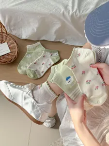 Floral cotton sock detail in green and beige, featuring cute pastoral patterns for comfortable daily wear.