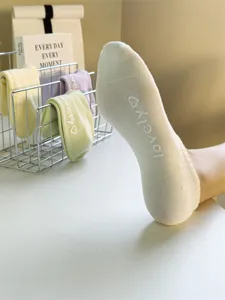 Women breathable low cut cotton socks with cute letter print and anti slip grip design.