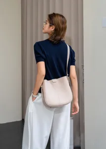 Leather bucket shoulder bag for women, vintage minimalist crossbody design for daily commute.