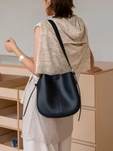 Genuine leather bucket bag for women, vintage shoulder bag, stylish commuter crossbody bag.