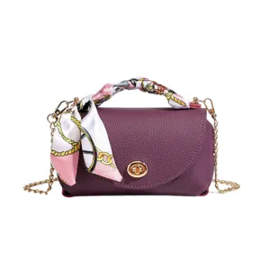 Purple leather shoulder bag with chain strap and stylish printed scarf handle decoration.