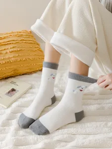 Cozy thick thermal winter socks detail shot featuring cute puppy embroidery and color design.