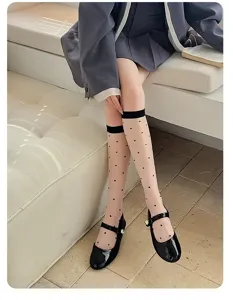 Sheer polka dot knee high socks for women, thin transparent summer hosiery with cute dots detail.