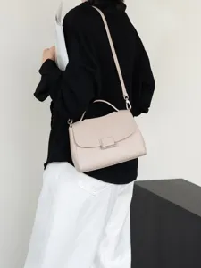 Elegant genuine leather women's shoulder bag with top handle and crossbody strap, neutral tone.