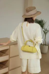 Genuine leather retro baguette shoulder bag for women, stylish niche handbag in yellow.