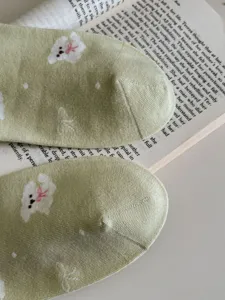 Green floral cotton socks detail view, short tube Mori style comfortable breathable boat socks.