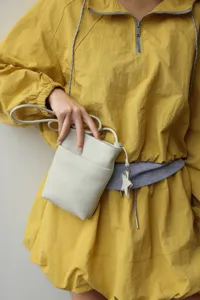 Mini genuine leather crossbody phone bag with cute star charm, stylish and compact for women.