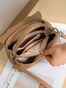 Genuine leather women handbag elegant cowhide shoulder messenger bag with interior zipper pocket.