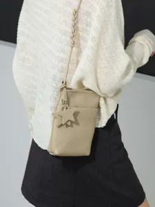 Mini genuine leather crossbody bag for women, cute star charm, small phone shoulder purse.