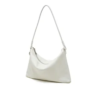 Detailed view of white genuine leather hobo shoulder bag, minimalist commuter handbag.