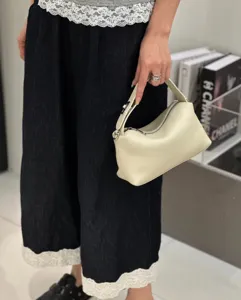 Minimalist genuine leather pillow bag, soft cowhide handbag with zipper, casual crossbody style.