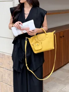 Yellow genuine leather crossbody handbag for women, top handle shoulder bag with mini pouch.