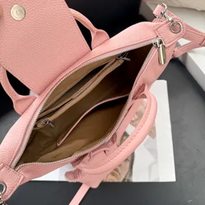 Pink genuine leather women handbag interior detail multi-compartment crossbody bag stylish