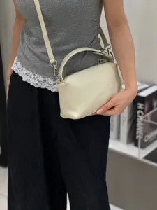 Genuine leather pillow crossbody bag, soft lunchbox handbag with top handle for women.