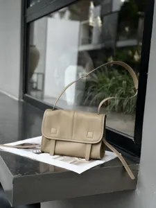 Premium genuine leather messenger bag for women, stylish crossbody shoulder bag for daily commute.