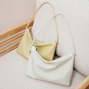 Genuine leather shoulder bag for women, stylish commute handbag with minimalist design.