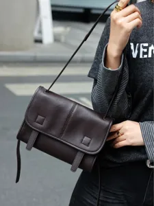 Dark brown top layer cowhide messenger bag, casual commuter crossbody shoulder bag for women.