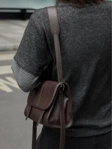 Brown genuine leather messenger bag for women, stylish crossbody and shoulder bag commuting.