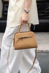 Classic leather handbag with top handle and crossbody strap, elegant commuter bag for women