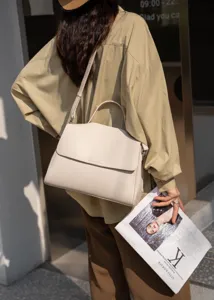 Soft leather shoulder bag detail shot showcasing elegant daily commute style and texture.