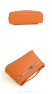 Borsa mini scatola in pelle arancione vista dettaglio con doppie zip metalliche e manico.