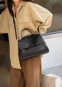 Classic black leather shoulder bag for women, stylish minimalist crossbody tote purse.