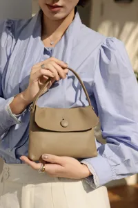 Top layer cowhide leather button detail bag spring new fashion women handbag daily commute.