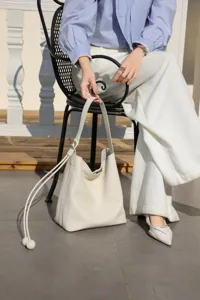 Genuine leather hobo bucket bag for women, large capacity shoulder underarm bag with stylish strap.