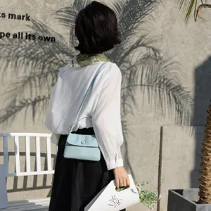 Genuine leather button shoulder bag for women, chic minimalist daily commute handbag pouch.
